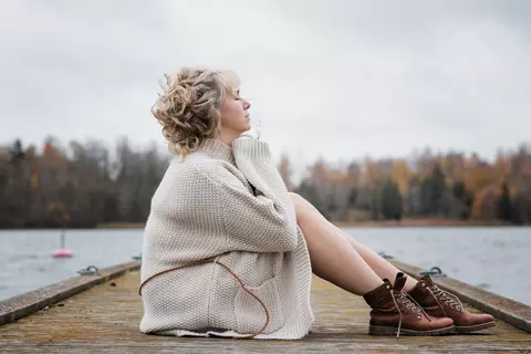 Woman sitting on street